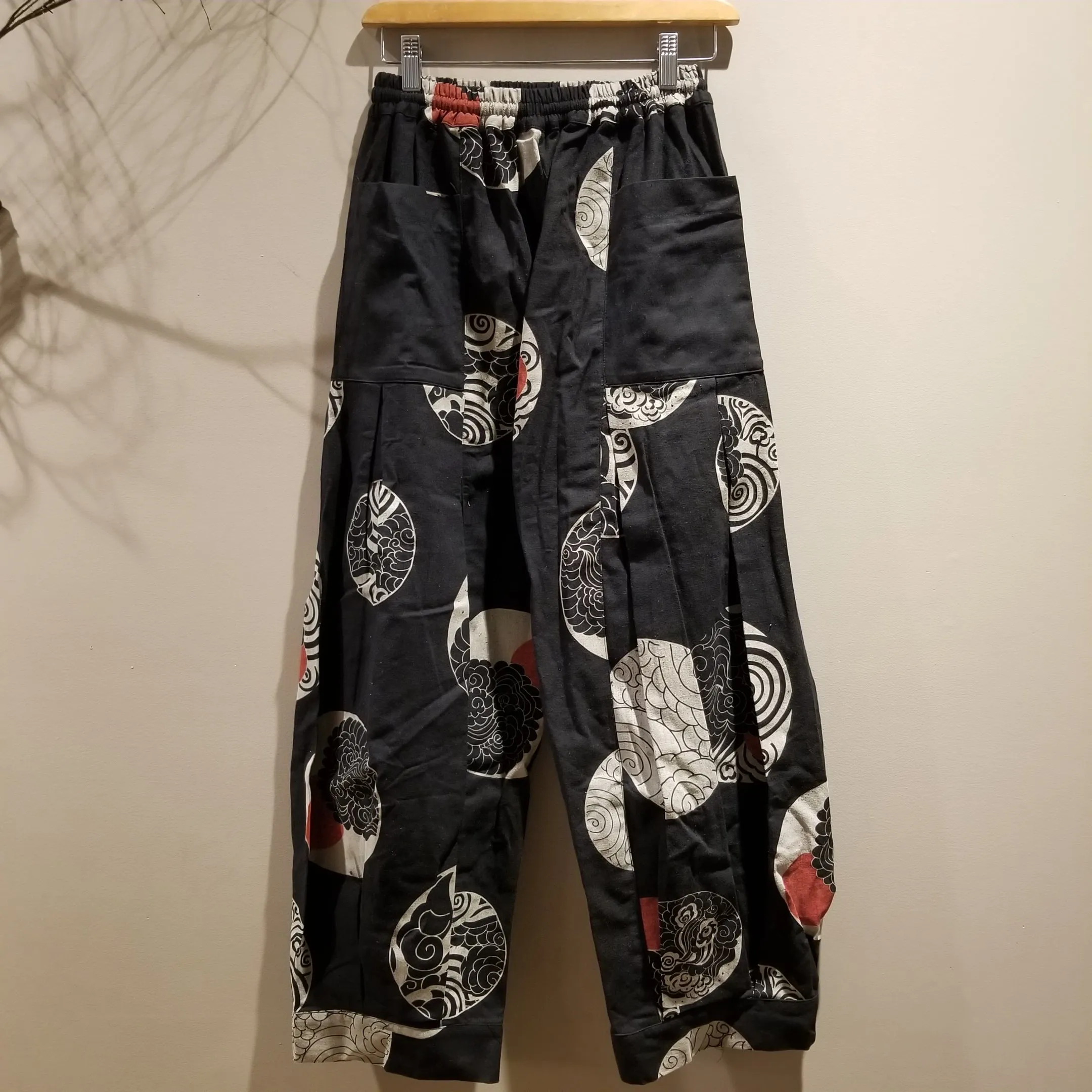 Wind & Sunset Motif Sweat Pants